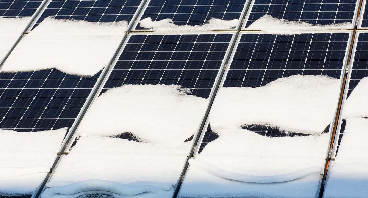 solar panels with snow