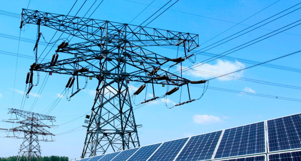 solar panels and power grid tower